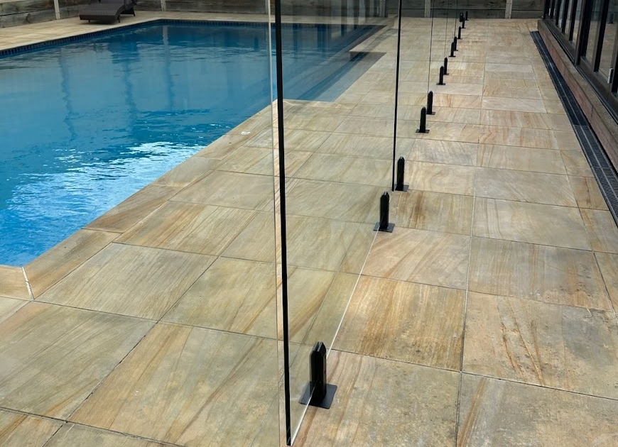 Frameless glass pool fencing installed in Ascot Vale by Melbourne Fencing Service, showcasing a modern and sleek design around a pool