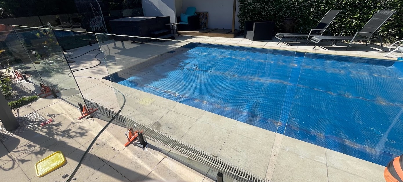 Modern framless glass pool fencing installed by Melbourne Fencing Service, offering privacy and contemporary style for residential properties in Melbourne